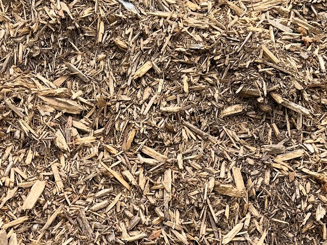 dry, light brown, shredded cypress mulch with a fibrous, textured appearance