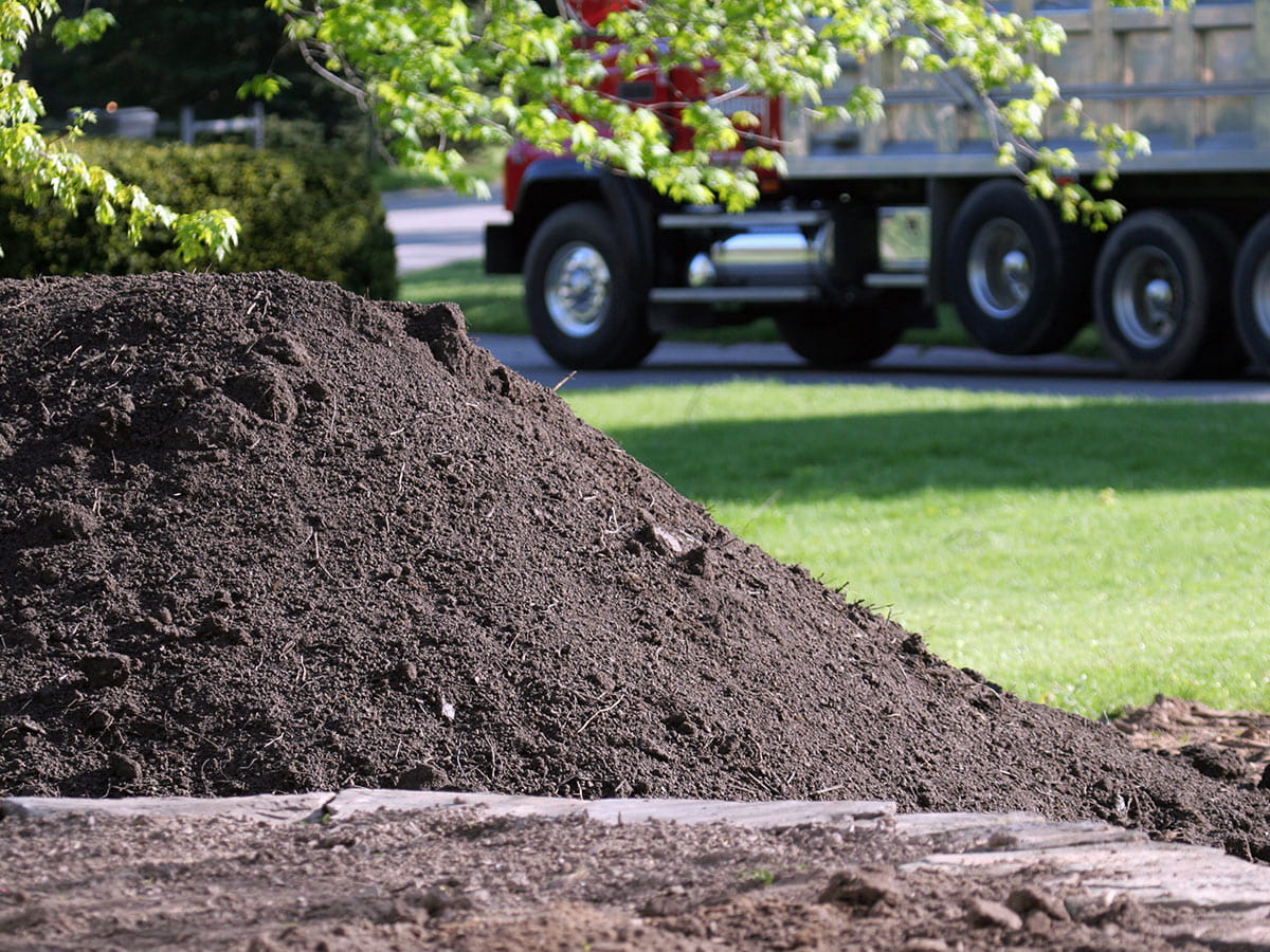 Bulk screened topsoil delivery in Picayune MS for lawns, grading, and landscape beds across Waveland, Bay St. Louis, Slidell, and Covington